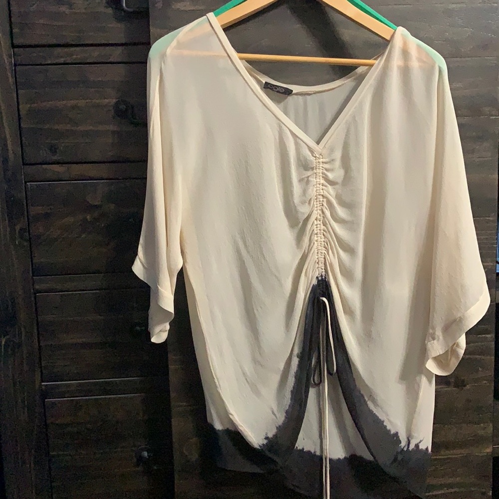 Ogle cream to black blouse